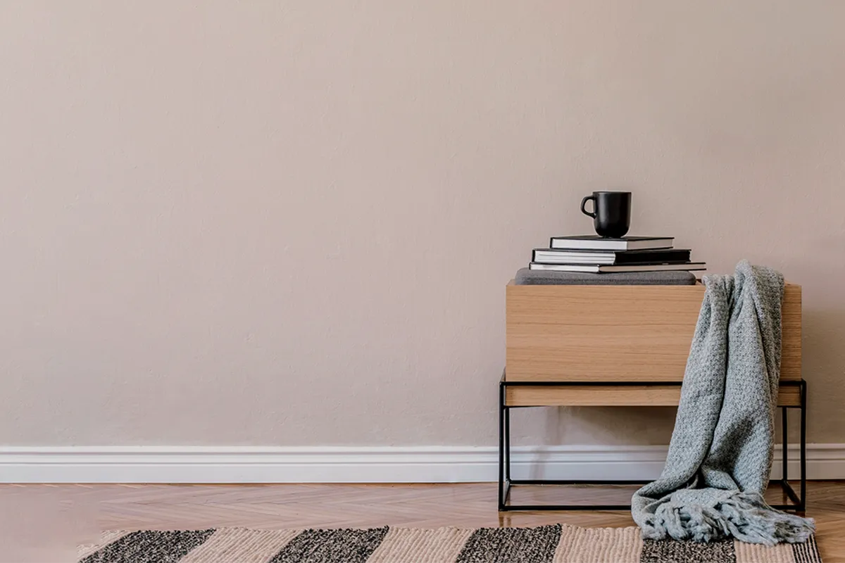 Brownish beige interior wall with side table