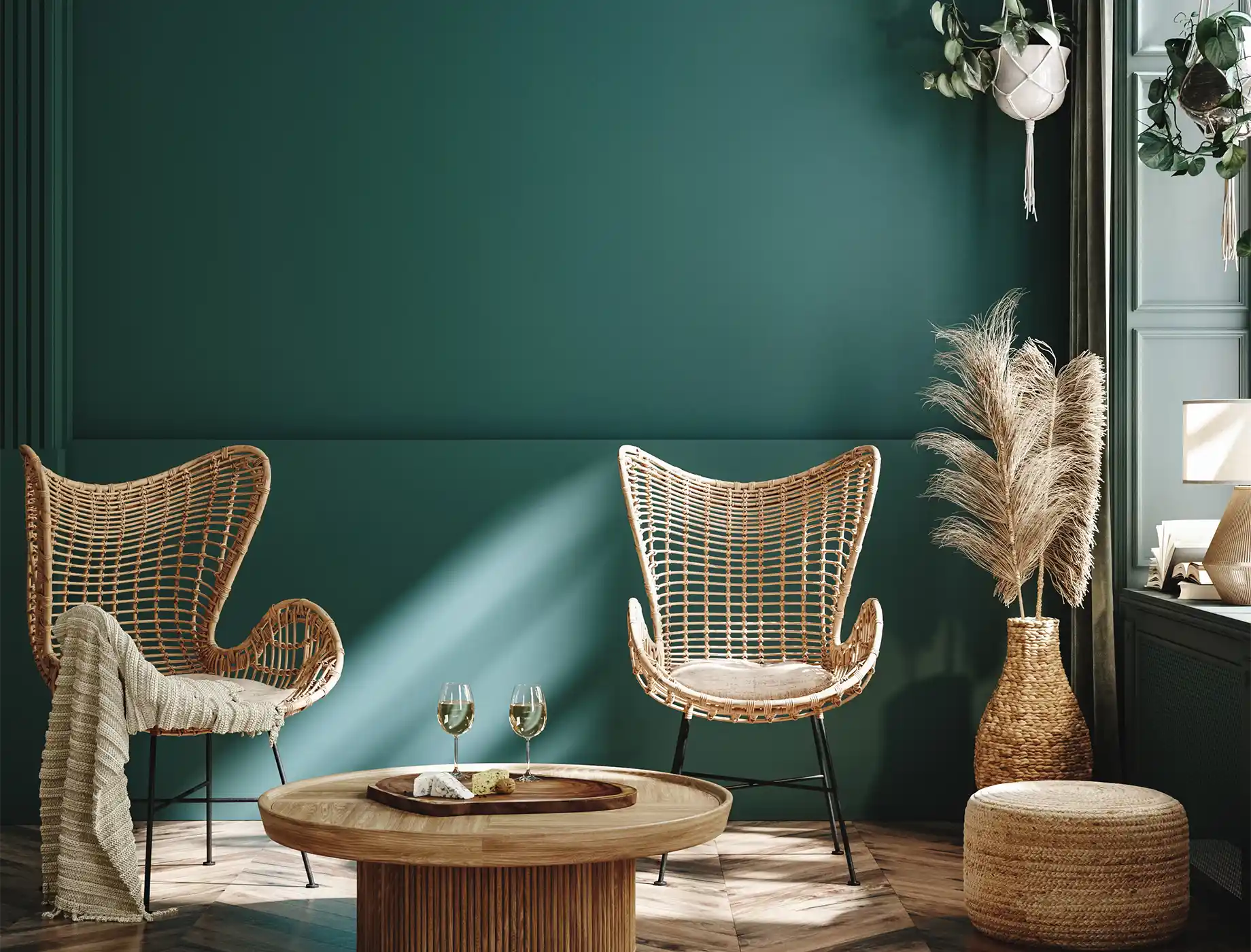 Stylish living room featuring a teal wall painted with Nippon Paint, complemented by modern wicker chairs, a wooden coffee table, and decorative plants for a cozy atmosphere.