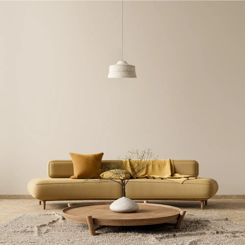 Japandi-styled room with white walls, a yellow sofa, and a table