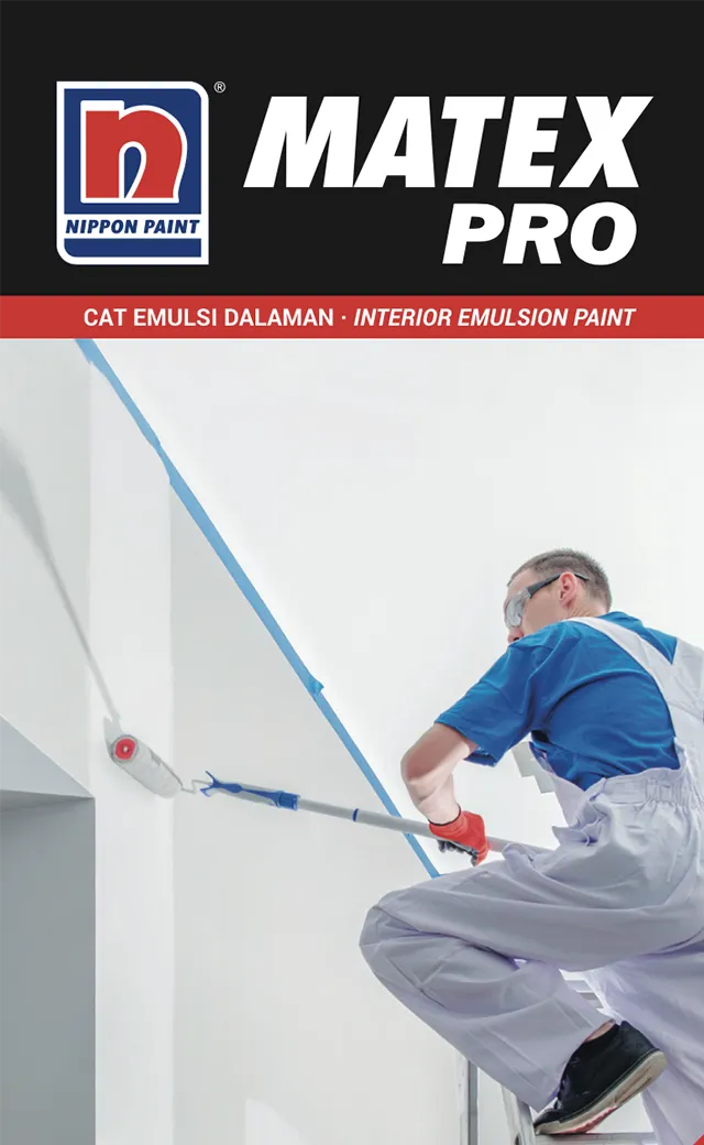 A painter applying Nippon Paint Matex Pro interior emulsion paint to a wall, showcasing a professional finish.